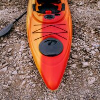 high-angle-photo-of-kayak-on-rocky-ground-544989