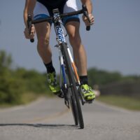 person-riding-road-bike-on-the-road-38296